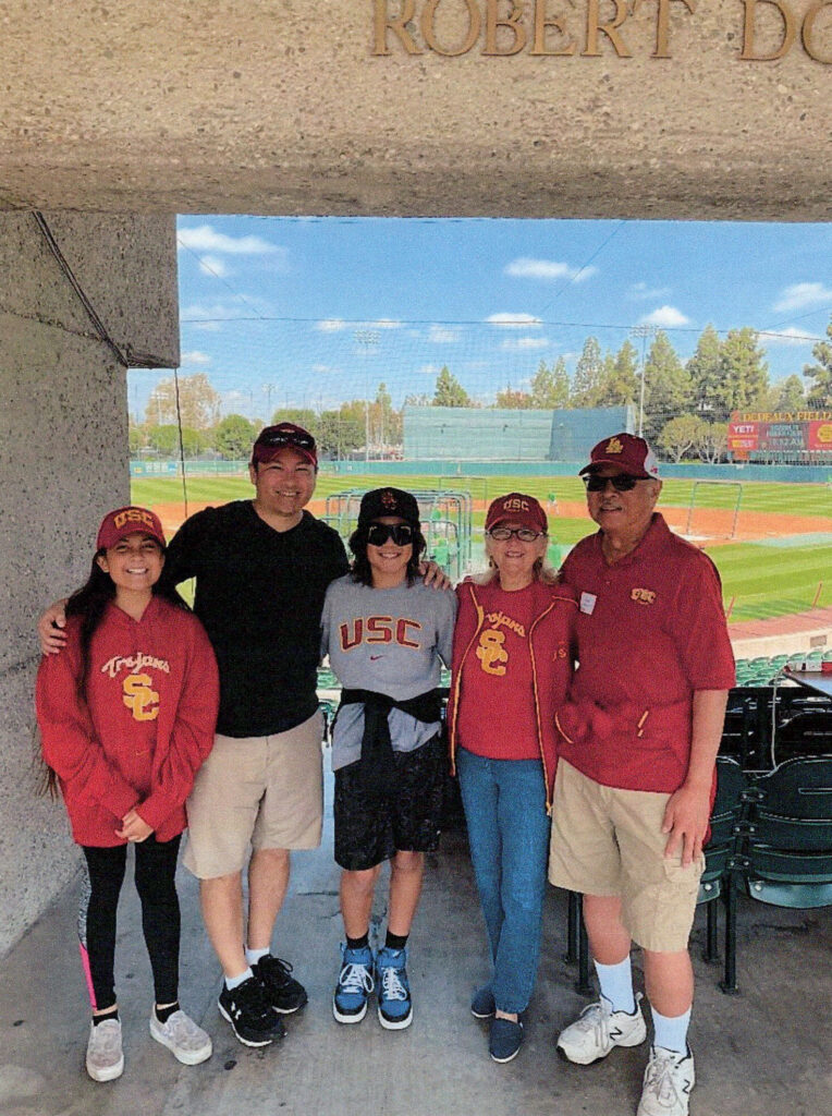 Brian and Kathy Kim with their son, grandson and granddaughter at a USC baseball game in 2023. (Photo courtesy of Brian and Kathy Kim)