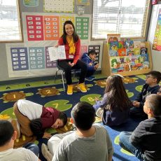 Danielle Colayco, PharmD ‘08, MS ‘10, read the coloring book to children at Delano Union School District in Delano, Calif. (Photo courtesy of Danielle Colayco)