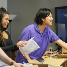 Members of NaloxoneSC, an initiative of the USC Student Chapter of the American Association of Psychiatric Pharmacists (AAPP-USC), prepare kits to distribute. (Photo by Isaac Mora / USC Mann)