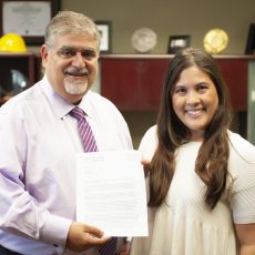 Dean Vassilios Papadopoulos awards first-year PharmD student Kristin Keeno the Fortuna Copia scholarship. (Photo by Isaac Mora)