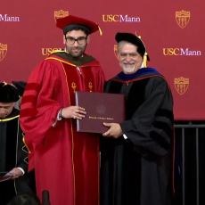 Syed Zaidi receives his PharmD degree from USC Mann Dean Vassilios Papadopoulos at the 116th USC Mann Commencement on Saturday, May 13, 2023.